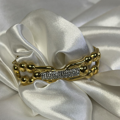 Braccialetto rigido ondulato con strass in acciao inox