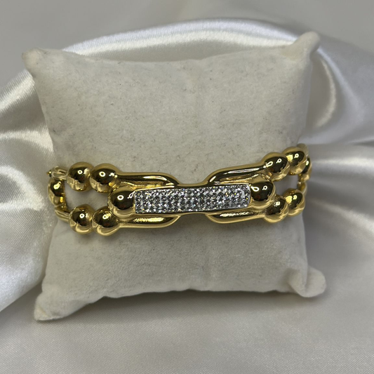 Braccialetto rigido ondulato con strass in acciao inox