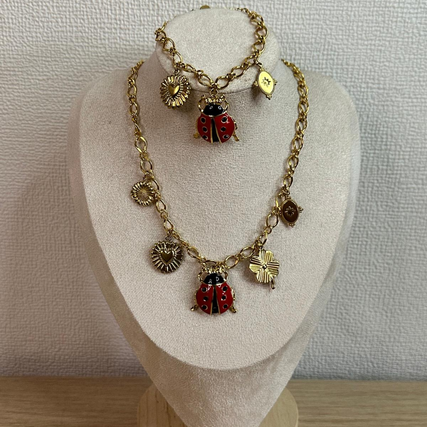 Parure con coccinella in acciaio inox